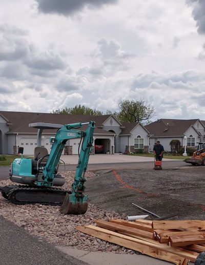 view of an excavator and other machines parked at the project site